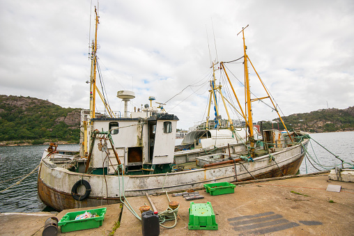 Lindesnes, Norway - september 09 2016: Decommisioned old wooden fishing boats used for trawling.