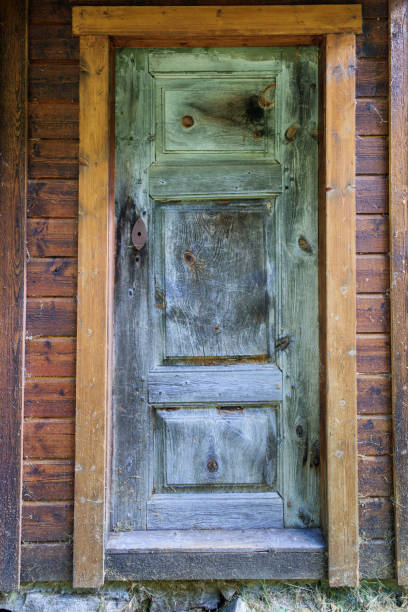 istock Ancient weathered single entrance door 1268032716