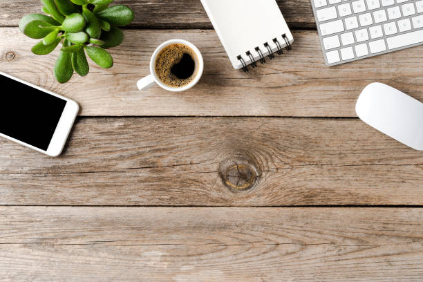 istock Office desktop with accessories on wooden background with copyspace 1268032869