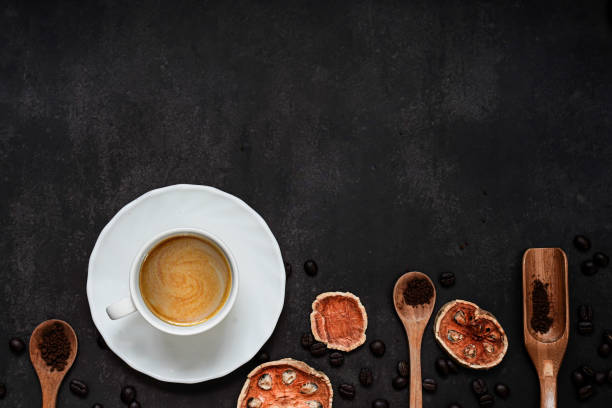 cup of coffee and coffee composition on black background. copy space. top view. flat lay. - napkin black blank ideas imagens e fotografias de stock