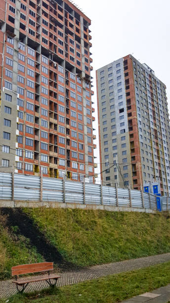 istock Multi-storey apartment buildings are being built, only red brick and window openings 1268034169
