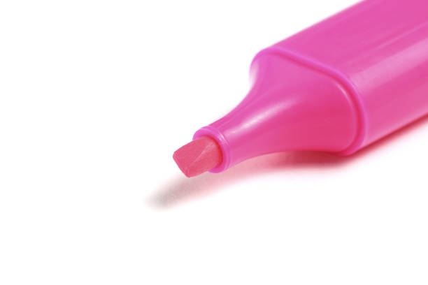 Pink neon marker for text or graphic works on a white background, close-up