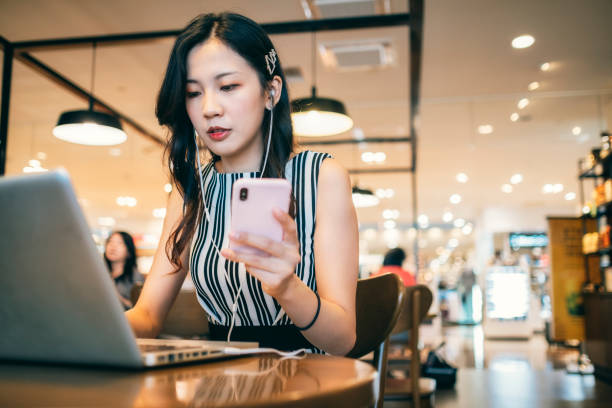 istock Asian woman working in cafe 1268039261