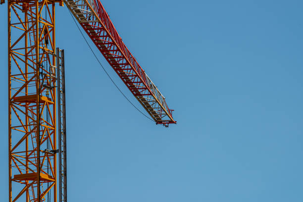 Red and white boom of a construction crane.