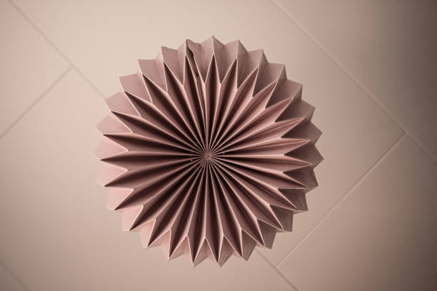 istock Symmetrical pink paper ceiling lamp 1268039506
