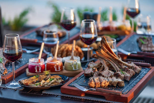 Steak House outdoor table with variety meat dishes - Hotel Luxury Restaurant
