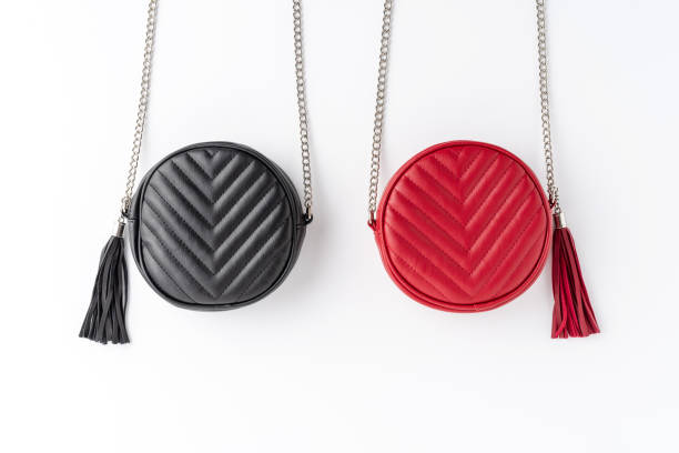 istock Red and black purses isolated on white table. Fashion background. Flat lay 1268042661