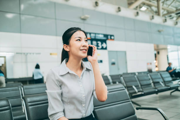 istock Woman waiting for train at the station 1268042877