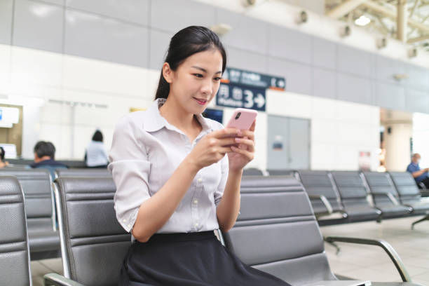 istock Woman waiting for train at the station 1268042917