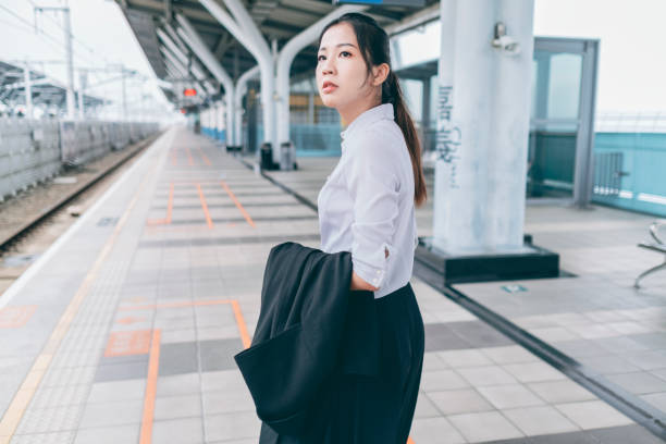 istock Young woman waiting for high speed rail 1268043104