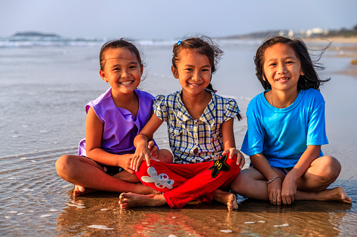 Group of happy Vietnamese girls on the beach, Vietnam