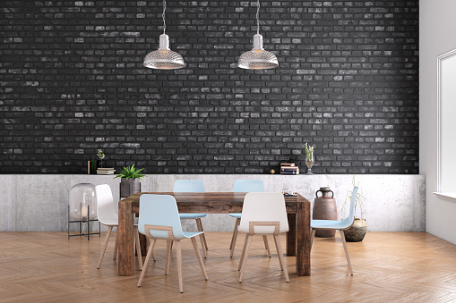 Modern dining room interior, closeup of wooden table with minimalist chairs. Blank black brick wall behind for copy space. render