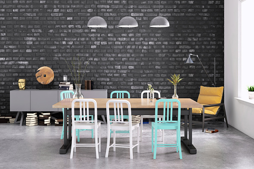 Modern dining room interior, of wooden table with minimalist chairs. Blank black brick wall behind for copy space. render