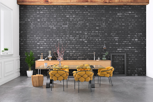 Modern dining room with comfortable chairs and designer furniture. Black brick wall behind for copy space. Render