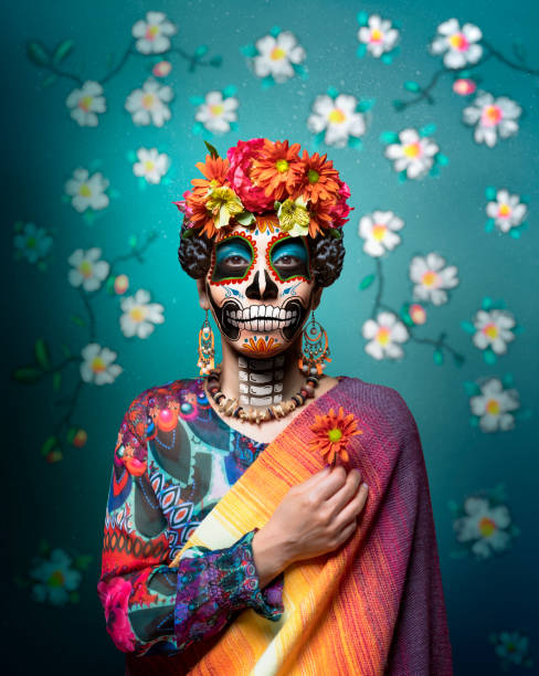 Woman with ceremonial make-up also known as Sugar skull, used in traditional Mexican Dia de los Muertos celebration.