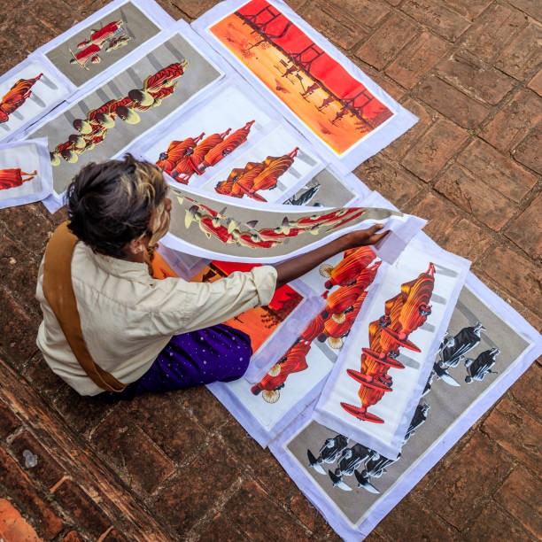Young Burmese boy selling sand paintings in Bagan, Myanmar