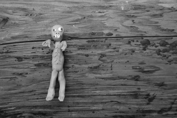 istock Figure of a zombie on a dark background. 1268056459
