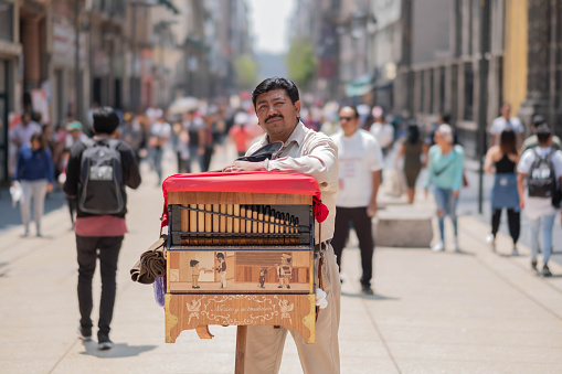 MEXICO CITY, MEXICO - 03 July 2017: Organillero del zócalo de la Ciudad de México, organ grinder in the city centre