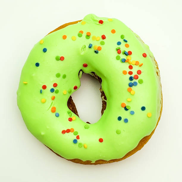 istock Donut with green glaze on white background top view 1268056735