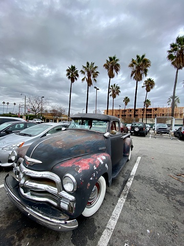 Santa Monica, USA - December 23, 2019: Old Chevrolet parked near Vons Supermarket in Santa Monica, USA