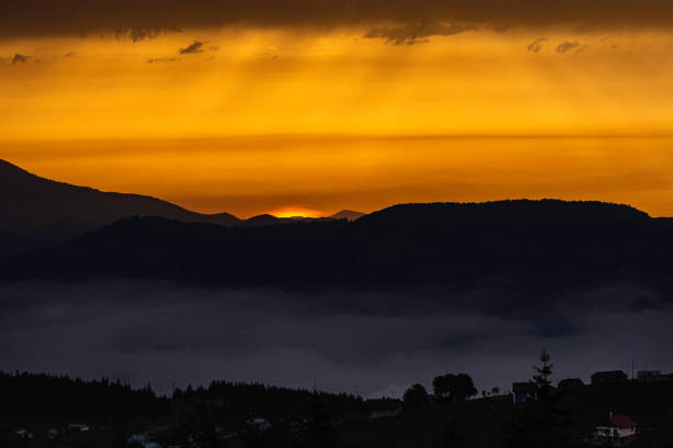 istock The sunset and the light that seeps through the clouds 1268057109