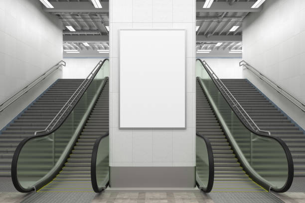istock Poster mock up on the wall with escalator and stairs. 1268058683