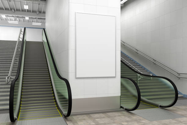 istock Poster mock up on the wall with escalator and stairs. 1268058717