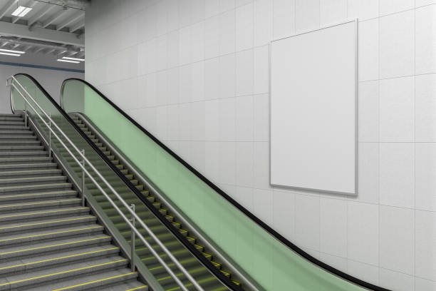 istock Vertical poster mock up on the wall with escalator and stairs. 1268058762