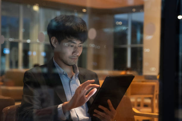 istock Businessman having coffee and doing his work in cafe. 1268061018