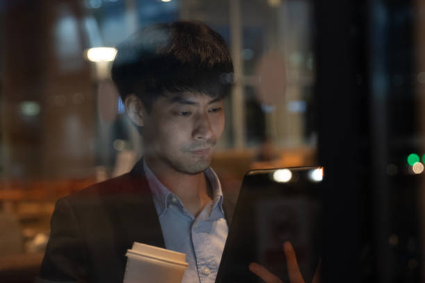 istock Businessman having coffee and doing his work in cafe. 1268061359