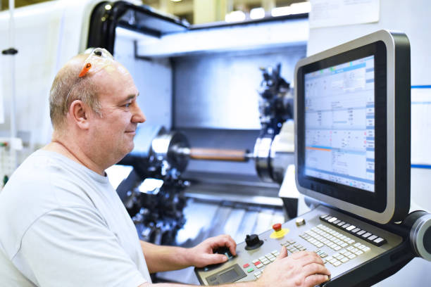 istock cnc machine in modern industrial mechanical engineering - workers at the workplace 1268063484