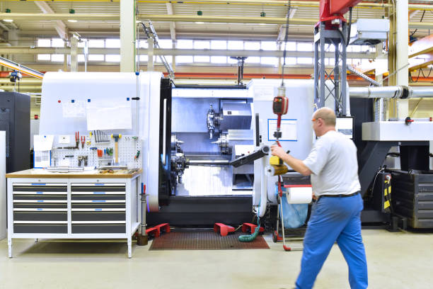 istock cnc machine in modern industrial mechanical engineering - workers at the workplace 1268063509