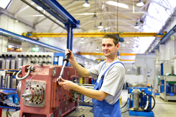 istock modern mechanical engineering - gear manufacturing factory - assembly by young workers 1268064073