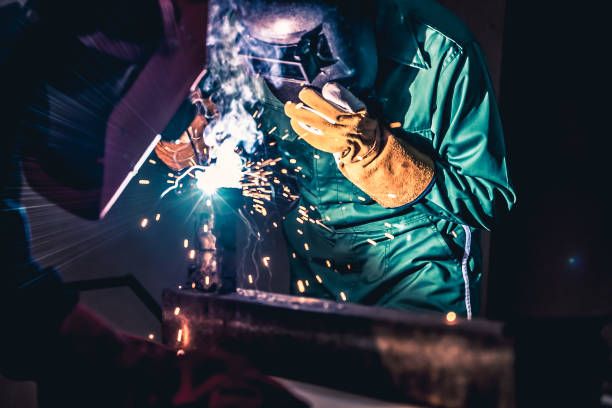 istock Metal welding steel works using electric arc welding machine 1268064192