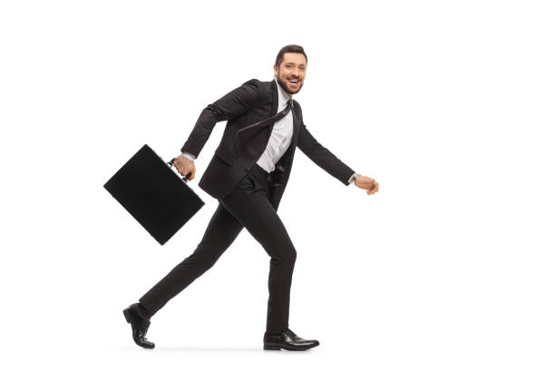 istock Businessman with a briefcase running and smiling 1268064275