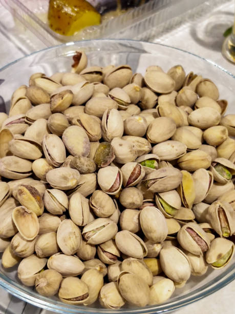 istock Salty ripe fried pistachios on a plate 1268065603