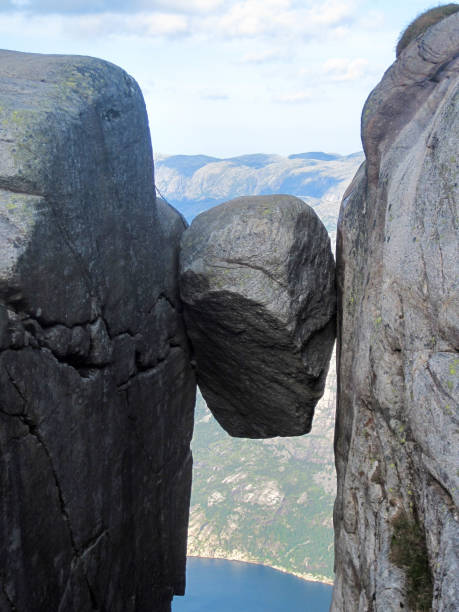 istock Kjeragbolten in Norway, round stone between two rocks 1268069481