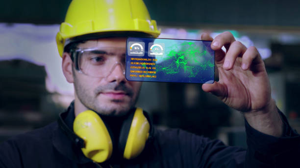 istock Factory worker use future holographic screen device to control manufacturing 1268070752