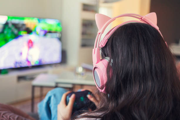 istock Girl playing a video game 1268072395