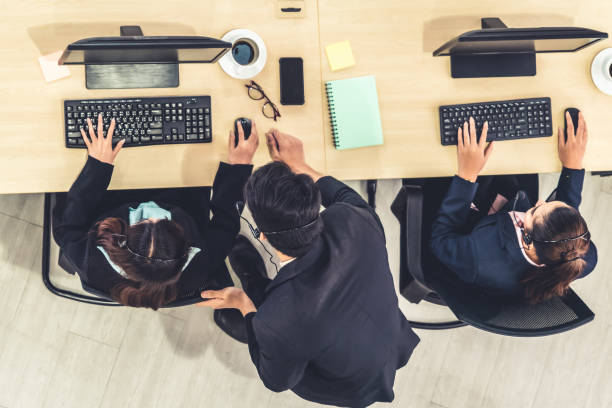 istock Business people wearing headset shot from top view 1268074949