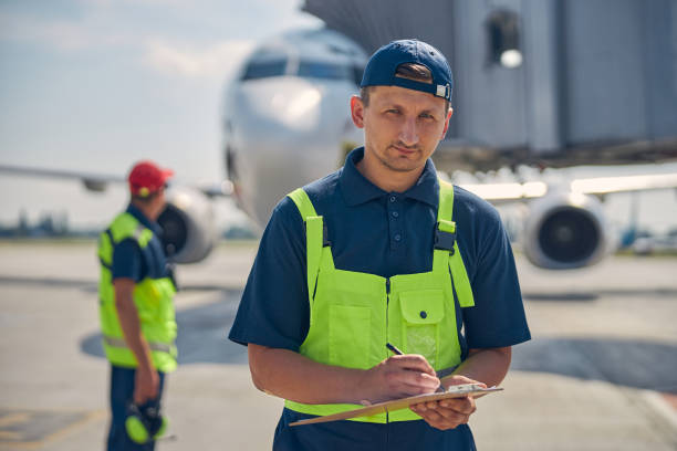 istock Man holding a clipboard in his hand 1268078258