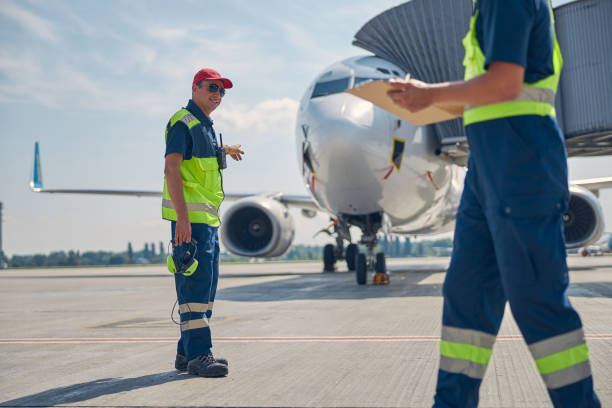 istock Aircraft maintenance supervisor talking to a mechanic 1268078259