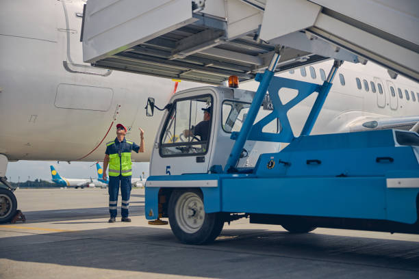 istock Skilled ground crew installing the aircraft steps 1268078297