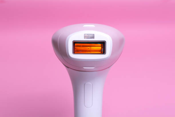 istock Photoepilator on a pink background. Hair removal tool. 1268078377