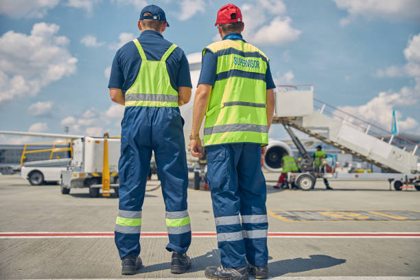 istock Two male technicians inspecting the ground equipment 1268080022