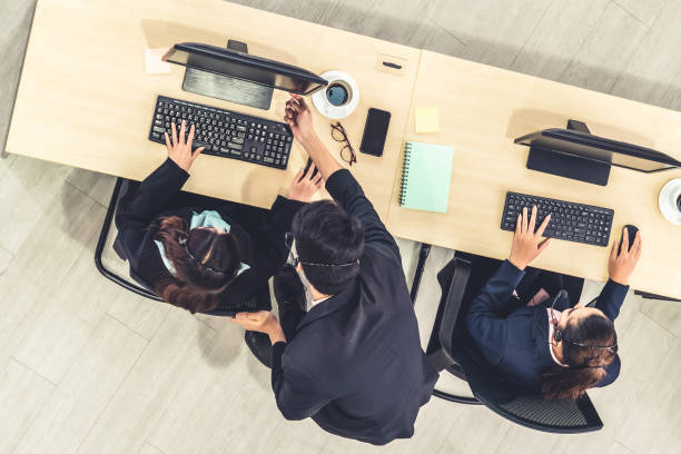 istock Business people wearing headset shot from top view 1268080890