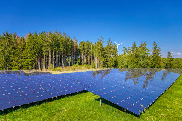 istock renewable energy: wind turbines and modern solar panels (HDRi) 1268084722