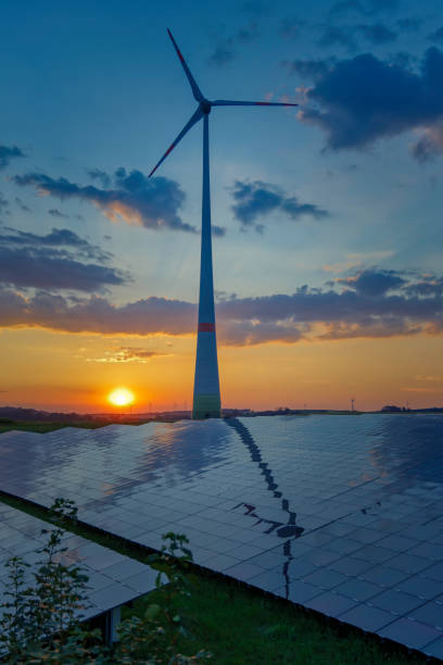 istock renewable energy: wind turbines and modern solar panels (HDRi) 1268084902