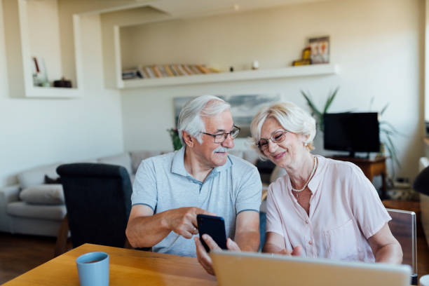 istock Senior couple working from home 1268086651