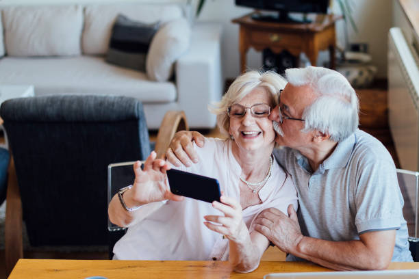 istock Cheerful senior couple taking a selfie 1268086653